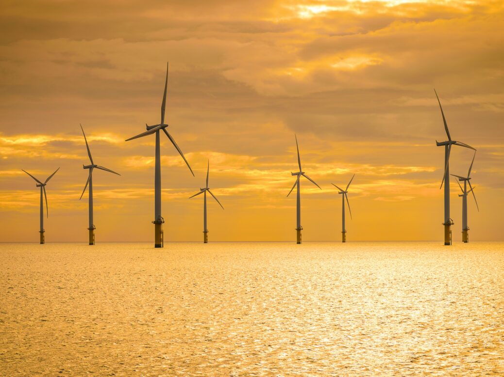 Offshore wind turbines at sunset