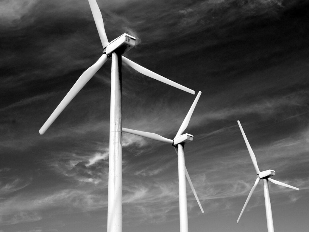 Wind turbines against a grey sky