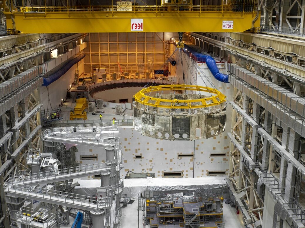 ITER fusion heat shield is moved into position.