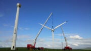 Wind turbine head suspended from crane