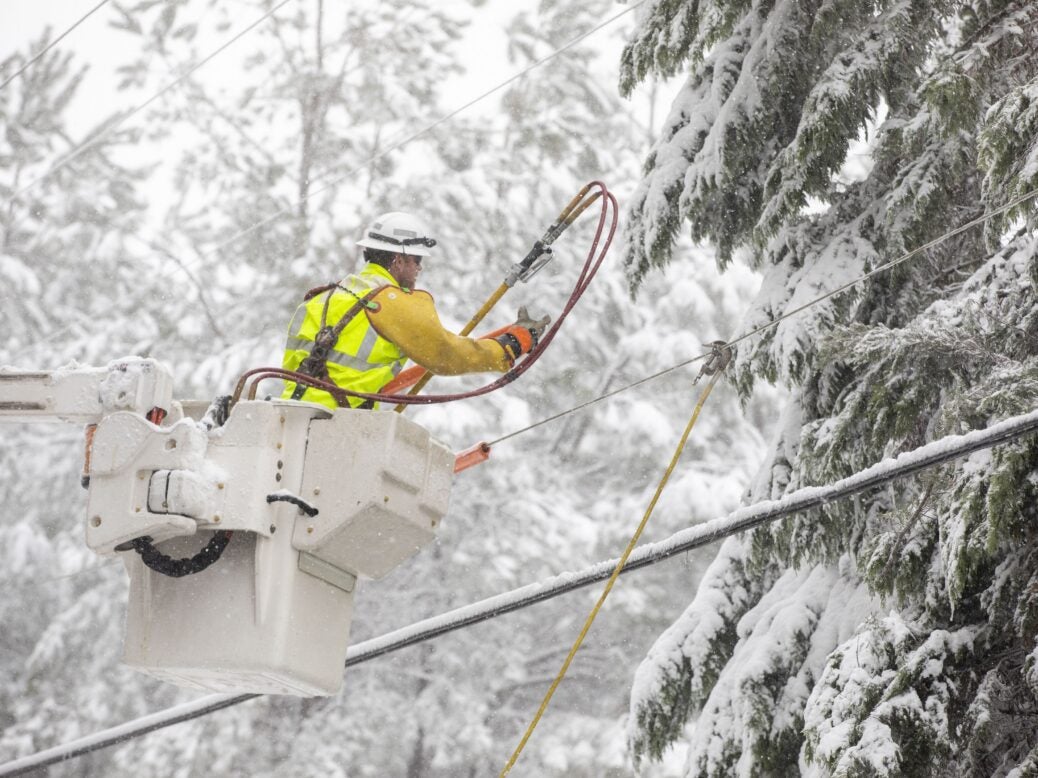 Workers maintain power lines after winter storm