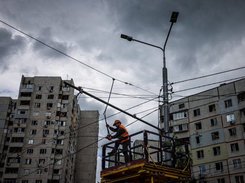 Worker restores power in Kharkiv, Ukraine.